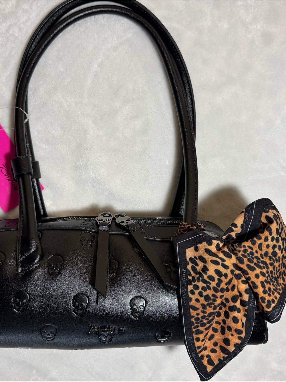 Betsey Johnson Black Embossed Skull Barrel Bag with Leopard Bow